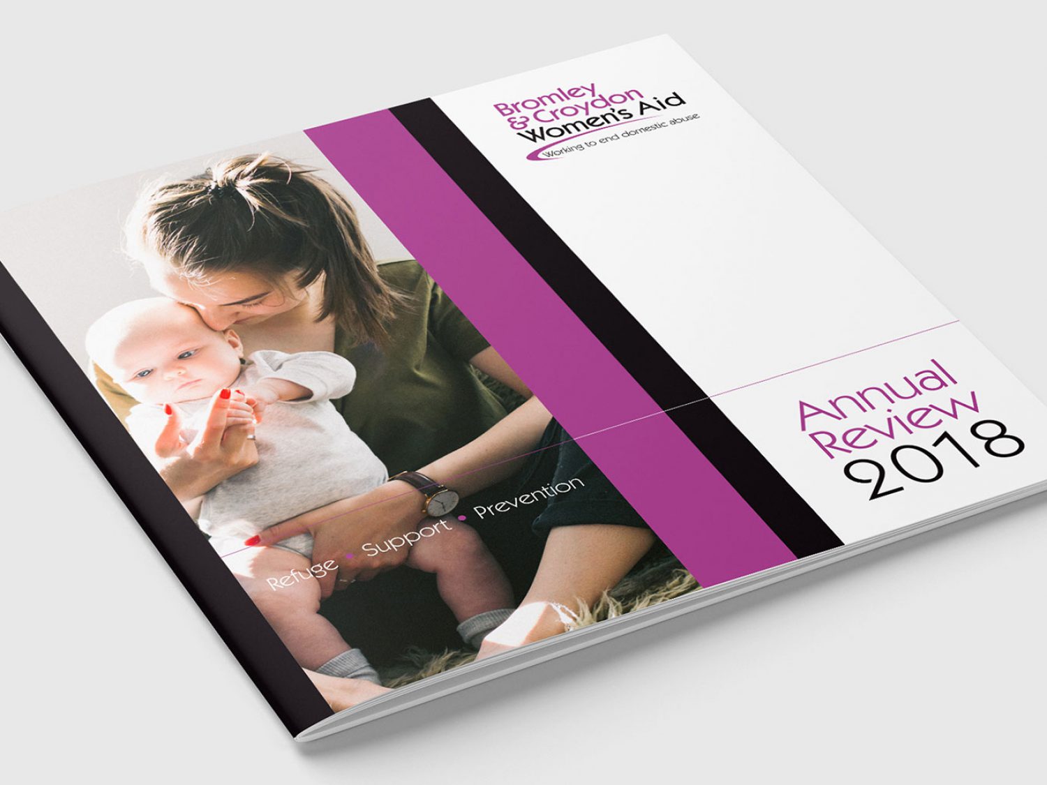 Print design and graphic design of an purple and black annual report for Bromley & Croydon Women's Aid