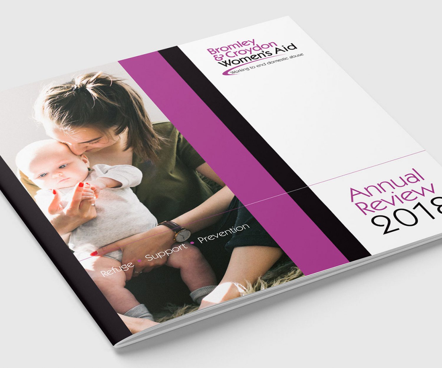 Print design and graphic design of an purple and black annual report for Bromley & Croydon Women's Aid