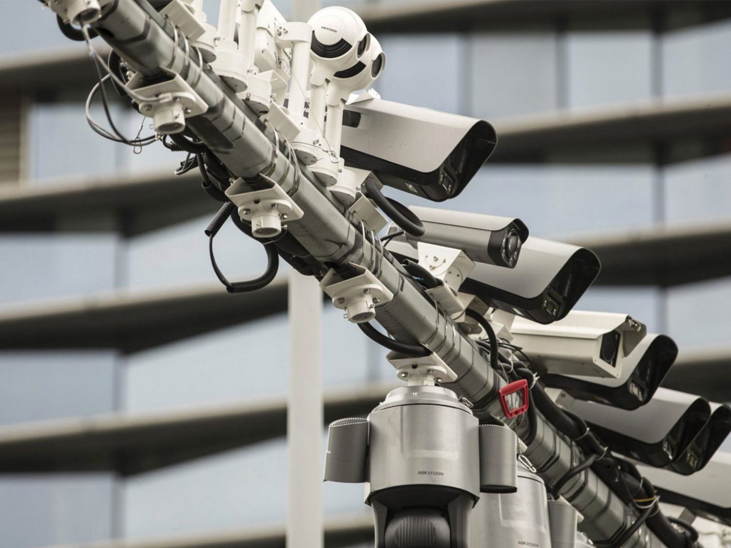 Ten security cameras lined up next to each other