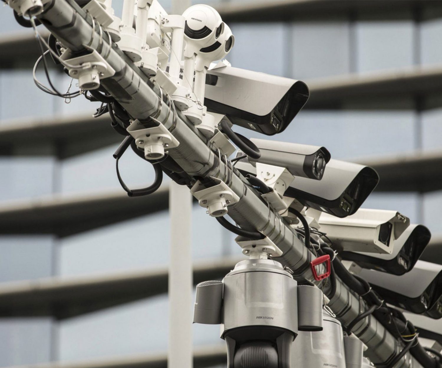 Ten security cameras lined up next to each other