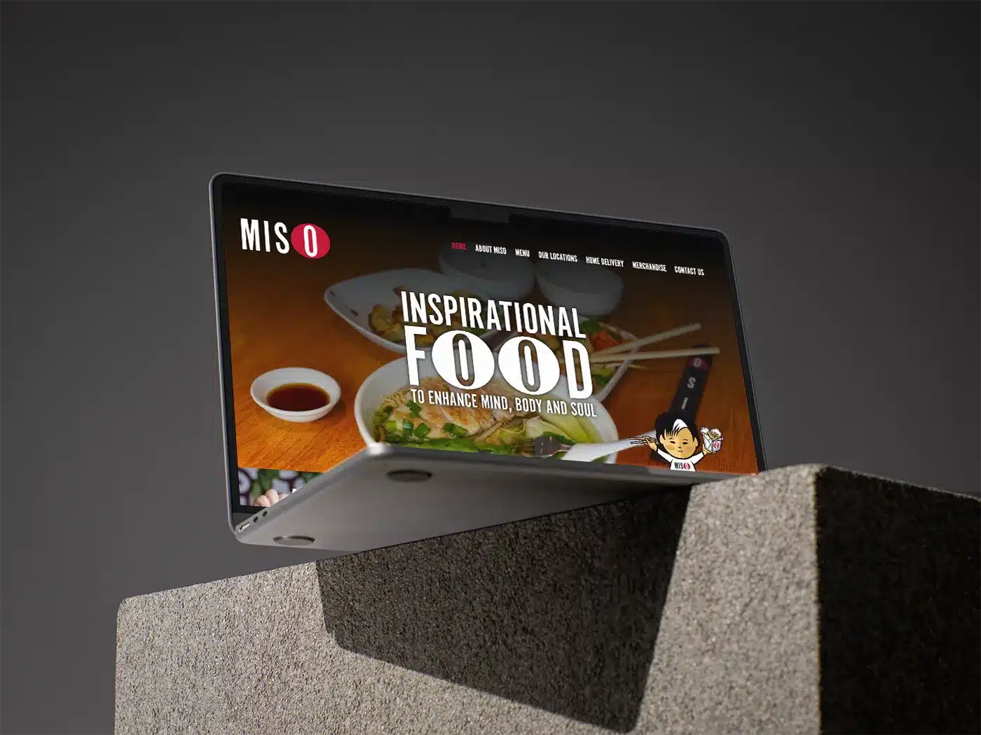 Miso Noodle Bar website homepage displayed on a MacBook.