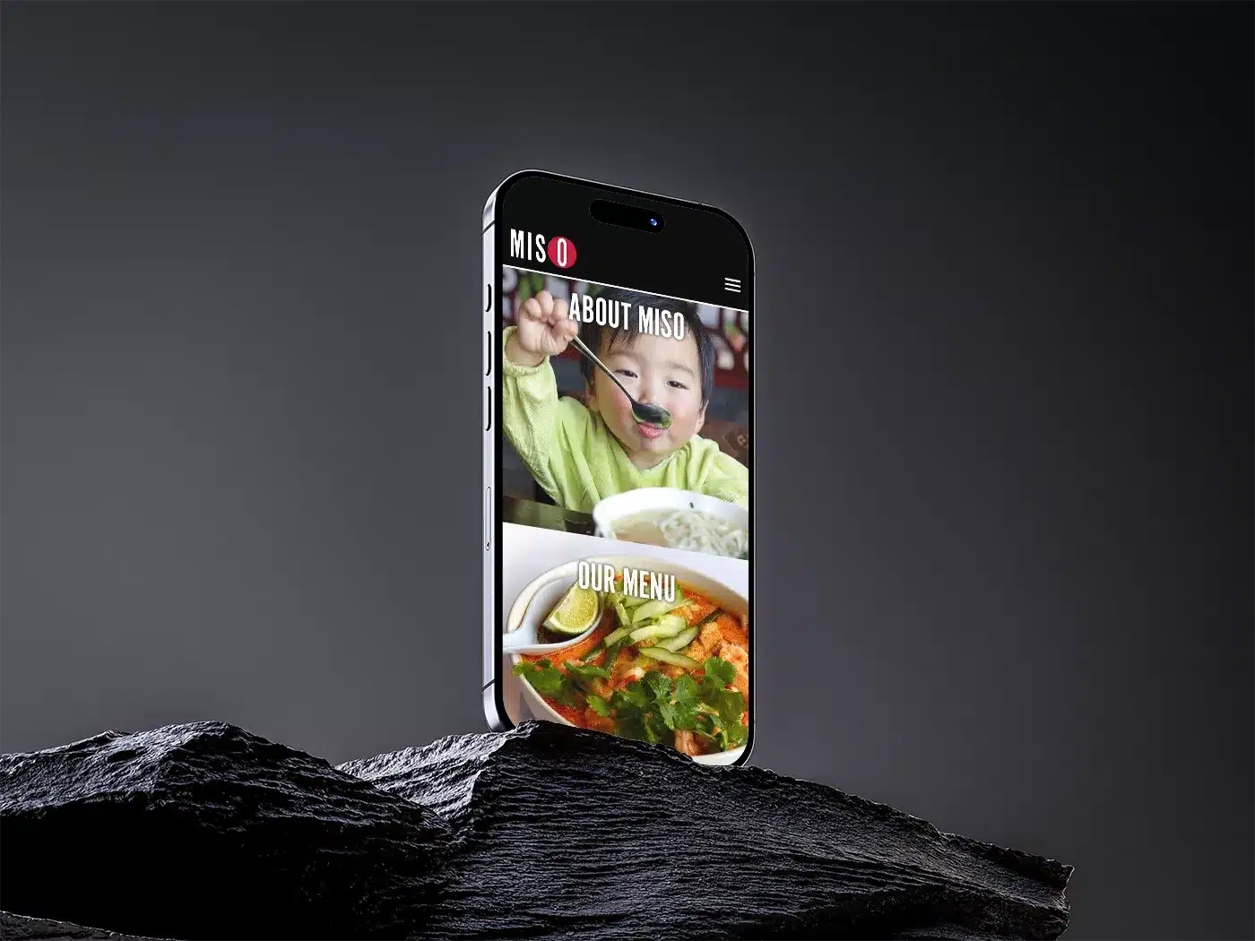 Miso Noodle Bar website homepage displayed on an iPhone.